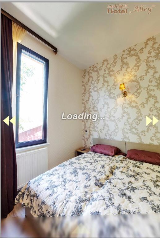 Postel nebo postele na pokoji v ubytování Hotel Alley