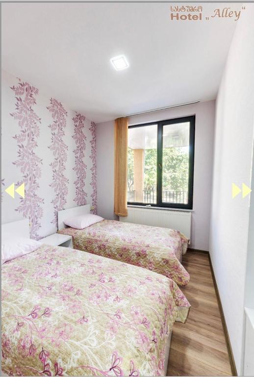 Postel nebo postele na pokoji v ubytování Hotel Alley