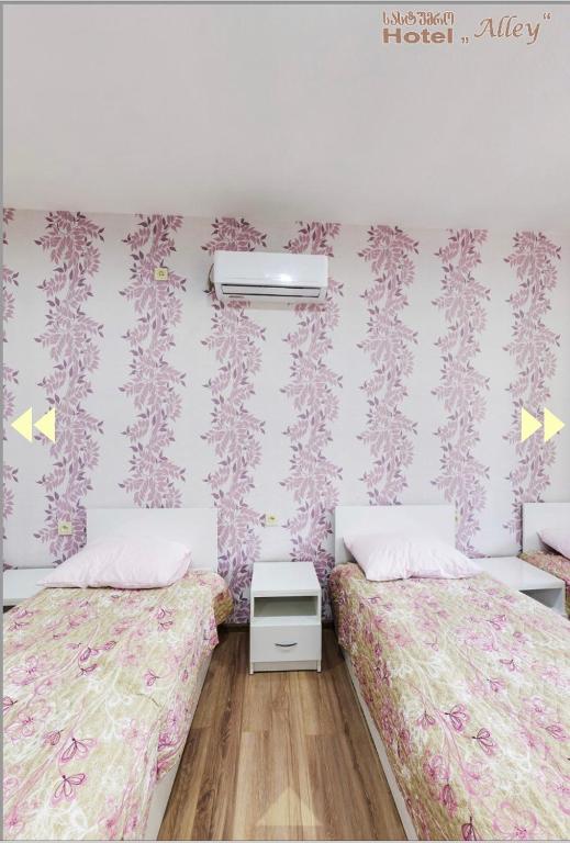 Postel nebo postele na pokoji v ubytování Hotel Alley