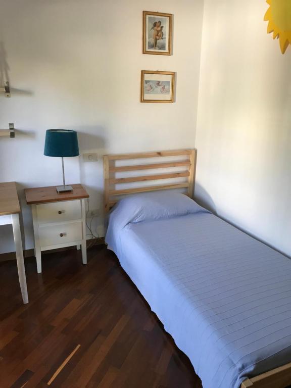 Łóżko lub łóżka w pokoju w obiekcie Casa Riccardo