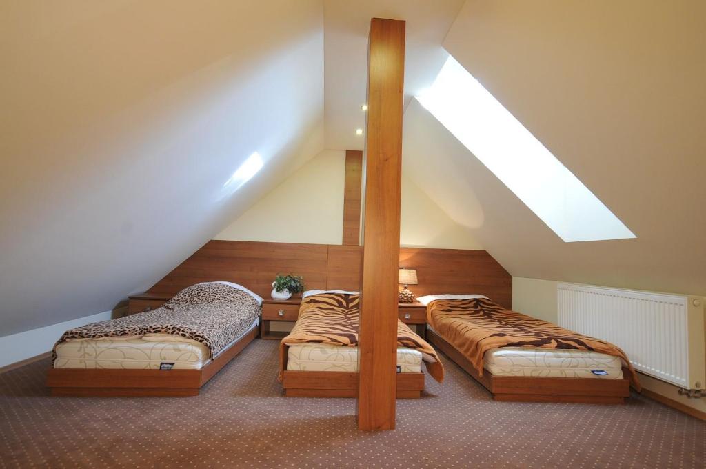 Postel nebo postele na pokoji v ubytování Vila Janka