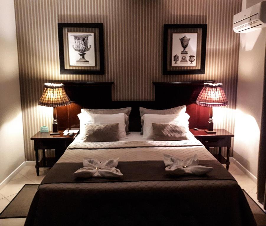 מיטה או מיטות בחדר ב-Villa Germânia