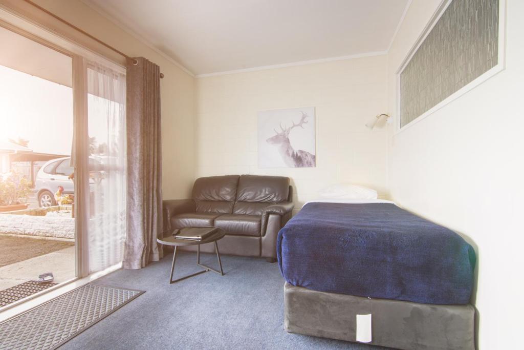 Postel nebo postele na pokoji v ubytování Kaitaia Motor Lodge