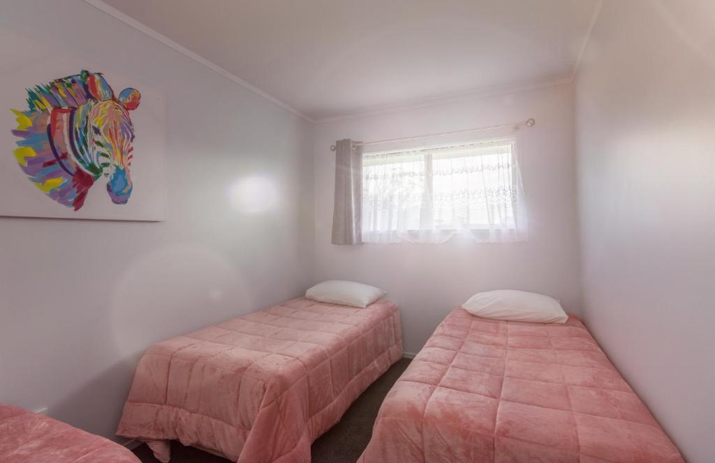 Postel nebo postele na pokoji v ubytování Kaitaia Motor Lodge