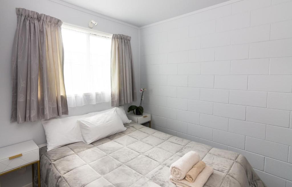 Postel nebo postele na pokoji v ubytování Kaitaia Motor Lodge