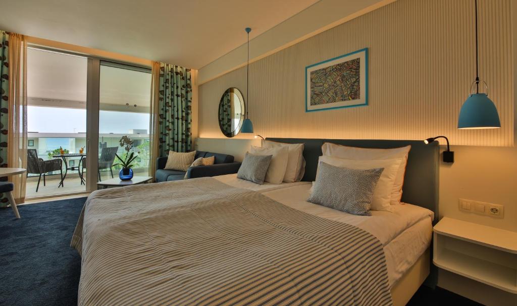 Кровать или кровати в номере White Lagoon Resort - All Inclusive