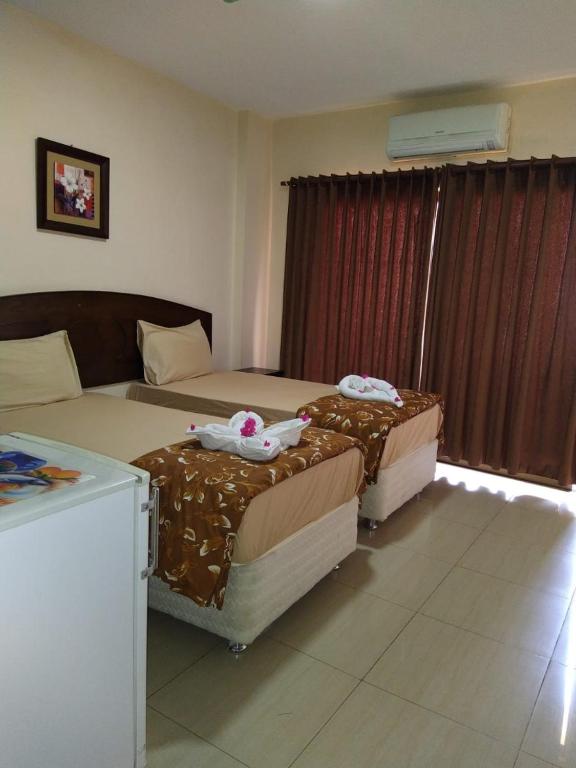 Postel nebo postele na pokoji v ubytování Baraka Al Aqaba Hotel Suites