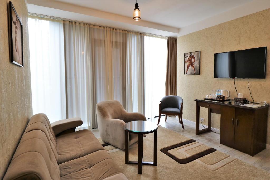 TV a/nebo společenská místnost v ubytování Hotel Liberty Theatre