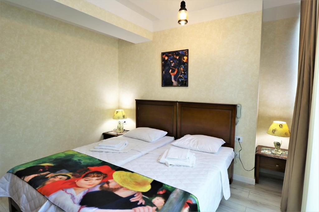 Postel nebo postele na pokoji v ubytování Hotel Liberty Theatre