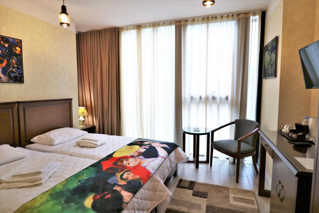 Postel nebo postele na pokoji v ubytování Hotel Liberty Theatre