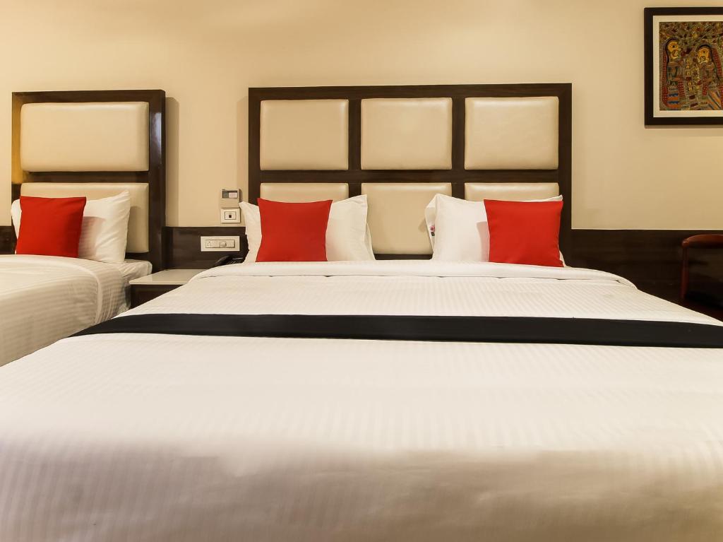 Postel nebo postele na pokoji v ubytování Hotel STM Palace