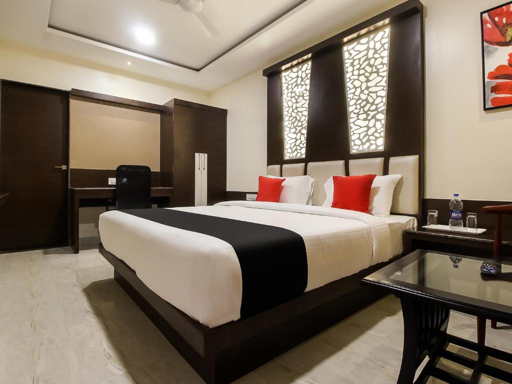 Postel nebo postele na pokoji v ubytování Hotel STM Palace