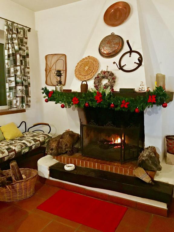 a living room with a fireplace with christmas decorations at Villa Sara di Puglia in Castellaneta