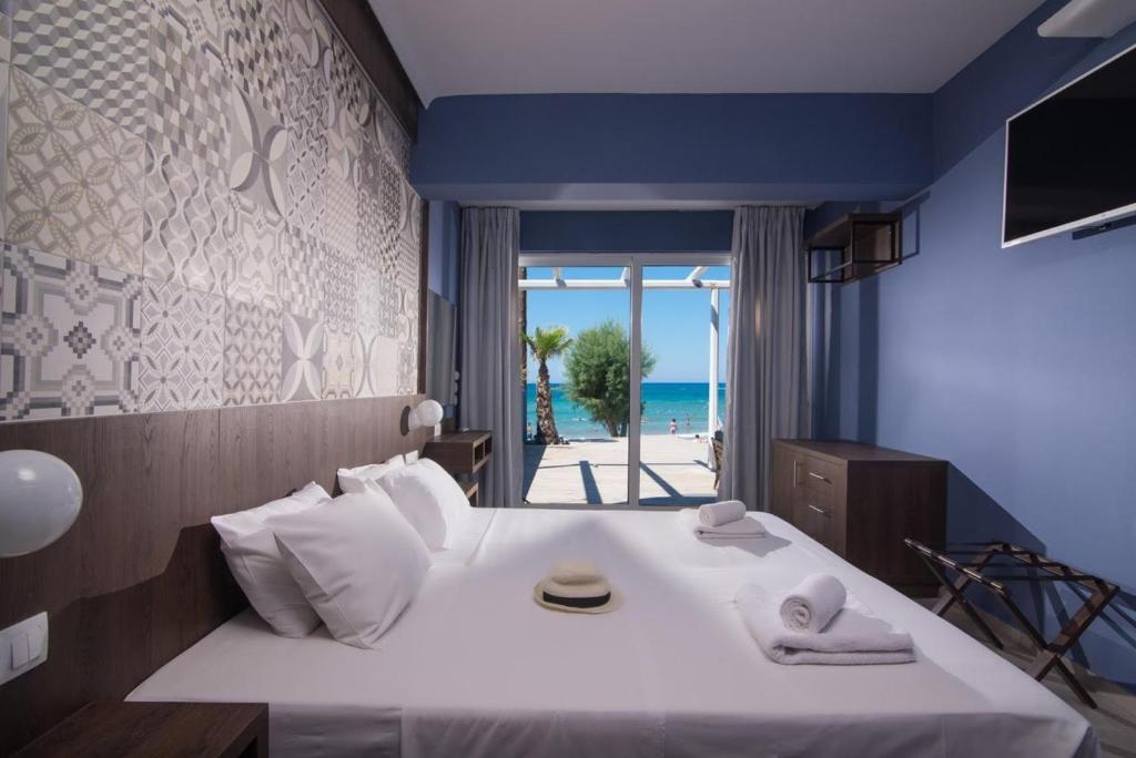 Postel nebo postele na pokoji v ubytování Stalis Hotel