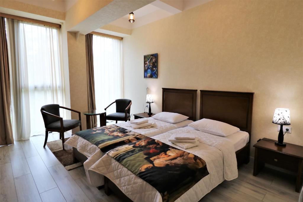 Postel nebo postele na pokoji v ubytování Hotel Liberty Theatre