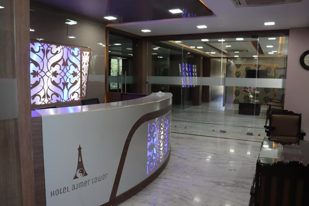 a lobby with a reception desk in a building at Hotel Ajmer Tower in Ajmer