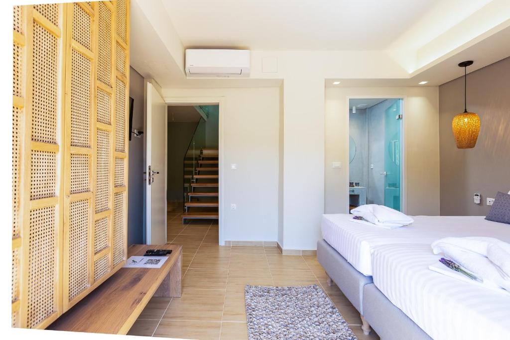 Posteľ alebo postele v izbe v ubytovaní Physis Villas Chania