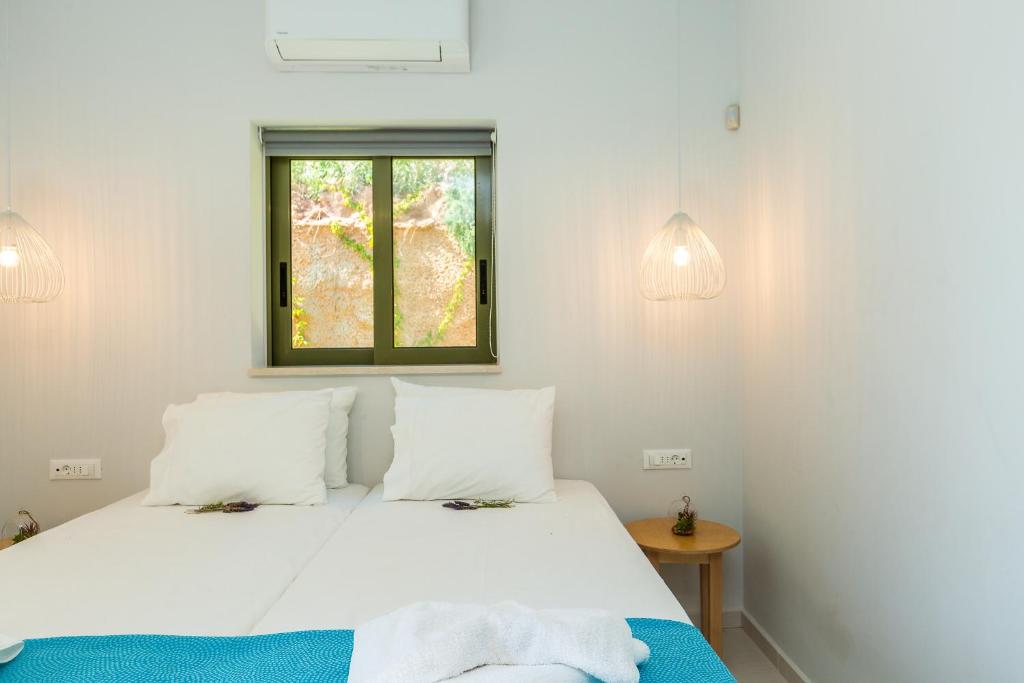 Posteľ alebo postele v izbe v ubytovaní Physis Villas Chania