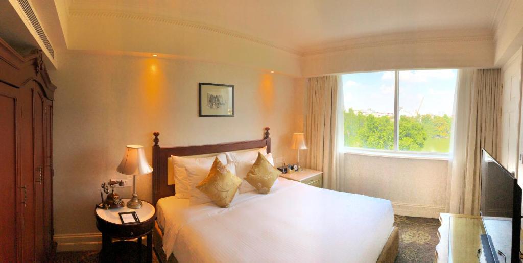 Postel nebo postele na pokoji v ubytování Apricot Hotel