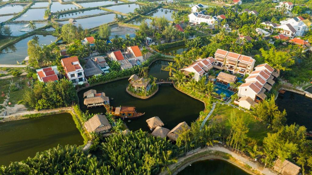 an aerial view of a house on a river at Zest Resort & Spa Hoi An in Hoi An