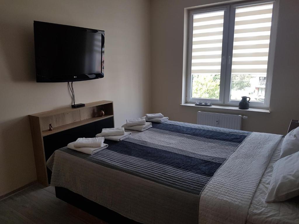 Posteľ alebo postele v izbe v ubytovaní Apartament Bałtyk Polanki Park, basen, sauna, fitness, sala zabaw dla dzieci