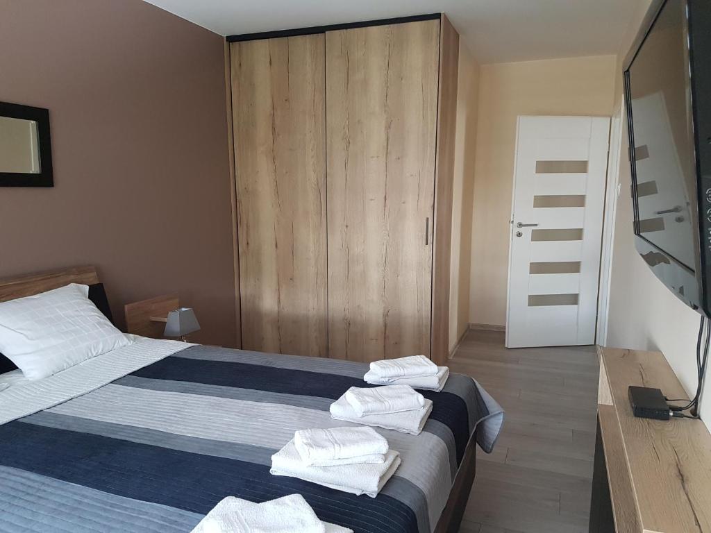 Posteľ alebo postele v izbe v ubytovaní Apartament Bałtyk Polanki Park, basen, sauna, fitness, sala zabaw dla dzieci