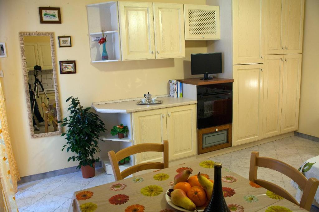 Kuchyň nebo kuchyňský kout v ubytování Residencefusaro appartamenti Specchia