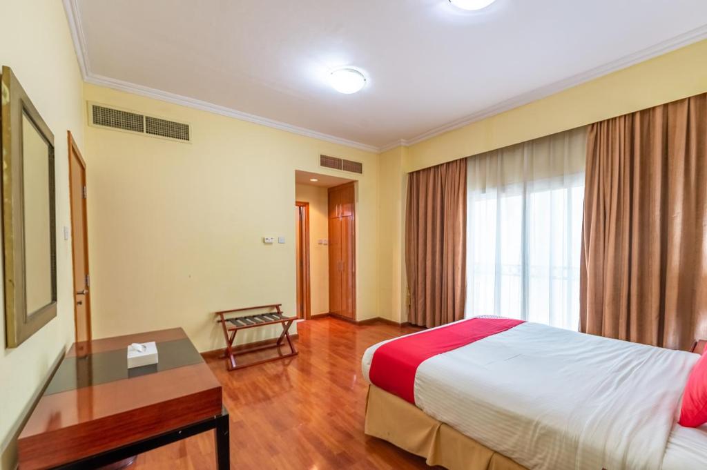 Postel nebo postele na pokoji v ubytování Ruwi Hotel Apartments, Sharjah