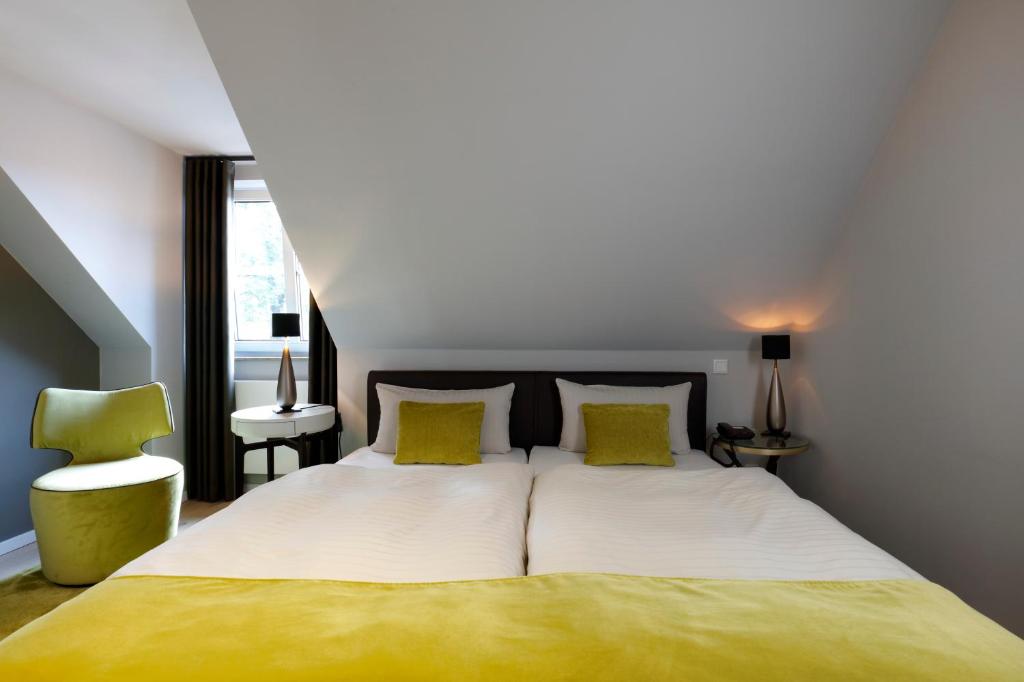 Postel nebo postele na pokoji v ubytování Patentkrug Design Hotel
