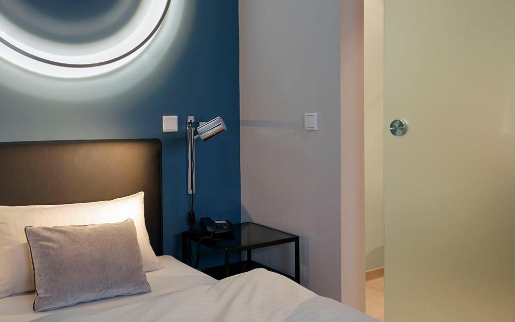 Postel nebo postele na pokoji v ubytování Patentkrug Design Hotel