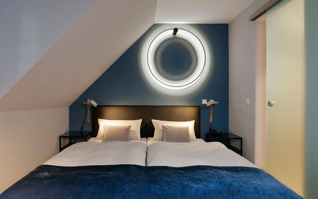 Postel nebo postele na pokoji v ubytování Patentkrug Design Hotel