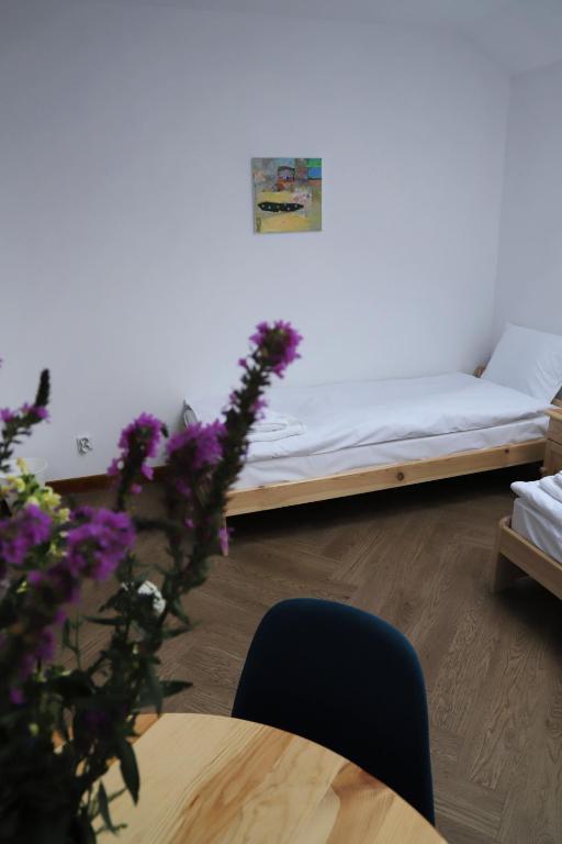 Łóżko lub łóżka w pokoju w obiekcie ArtRooms Pokoje Gościnne