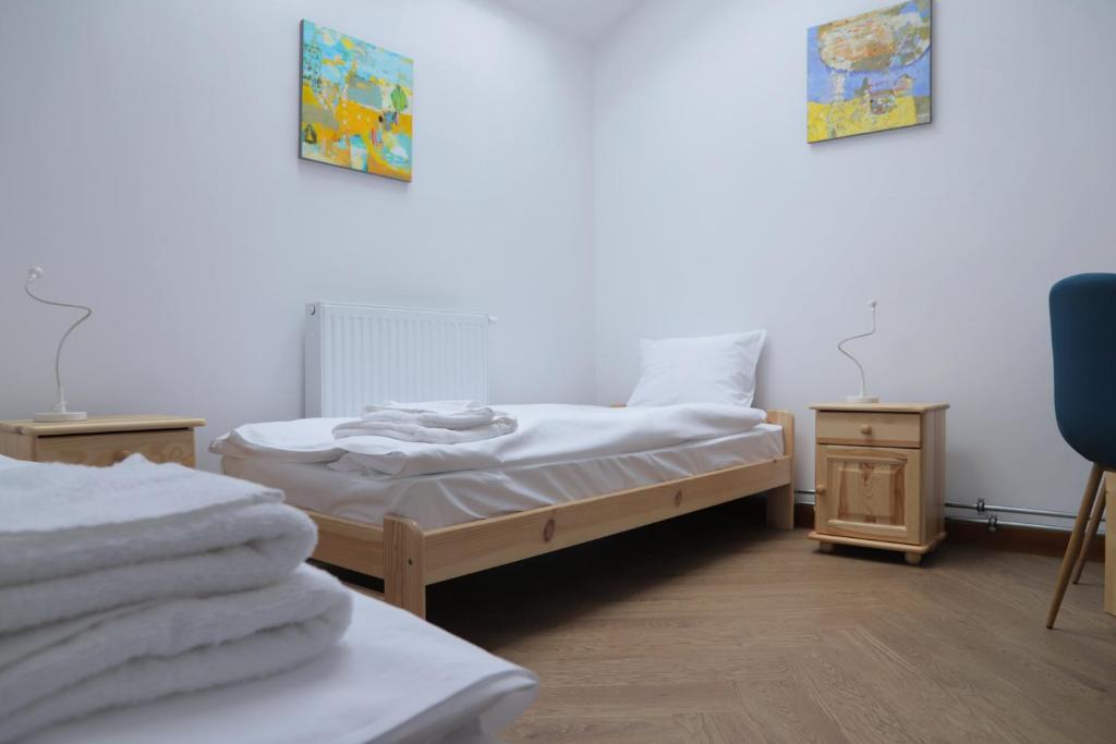 Łóżko lub łóżka w pokoju w obiekcie ArtRooms Pokoje Gościnne