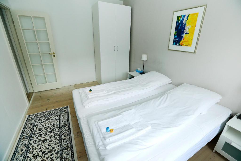 Postel nebo postele na pokoji v ubytování Hotel 9 små hjem