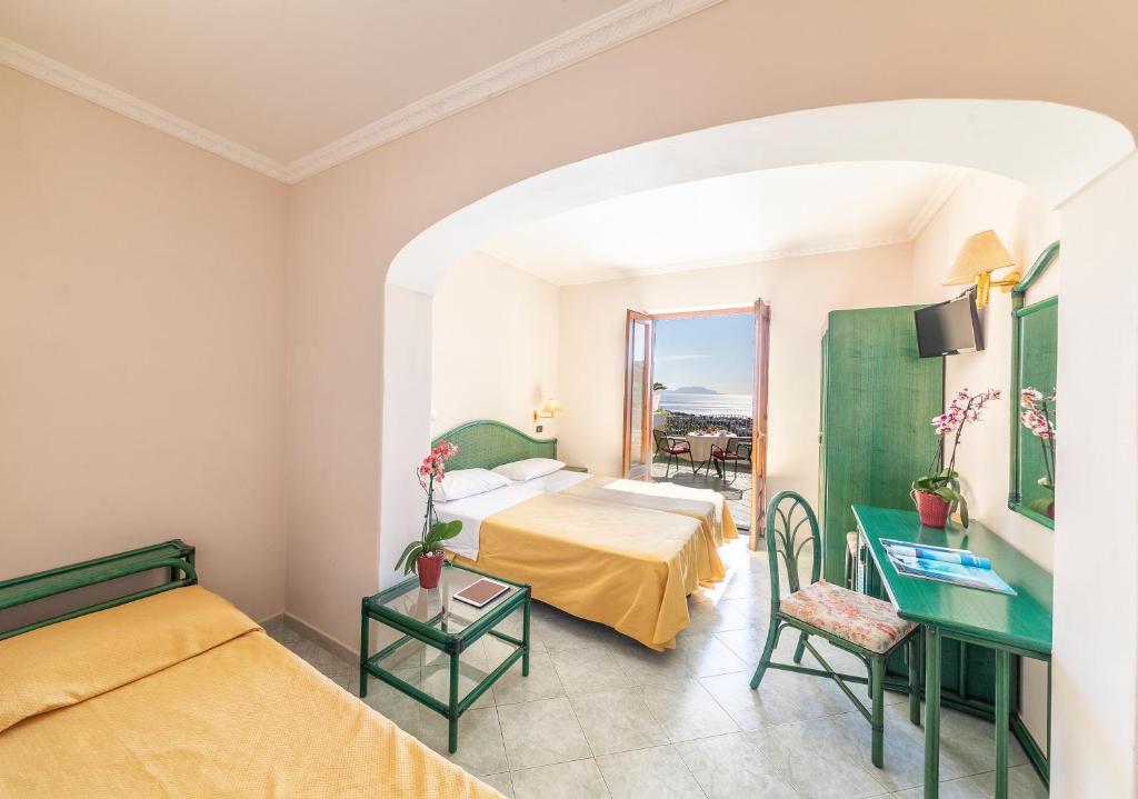 Postel nebo postele na pokoji v ubytování Hotel Belvedere