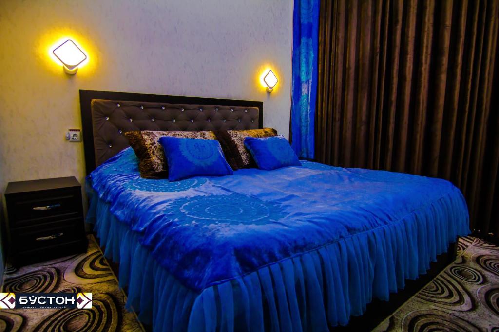 Кровать или кровати в номере Hotel Buston