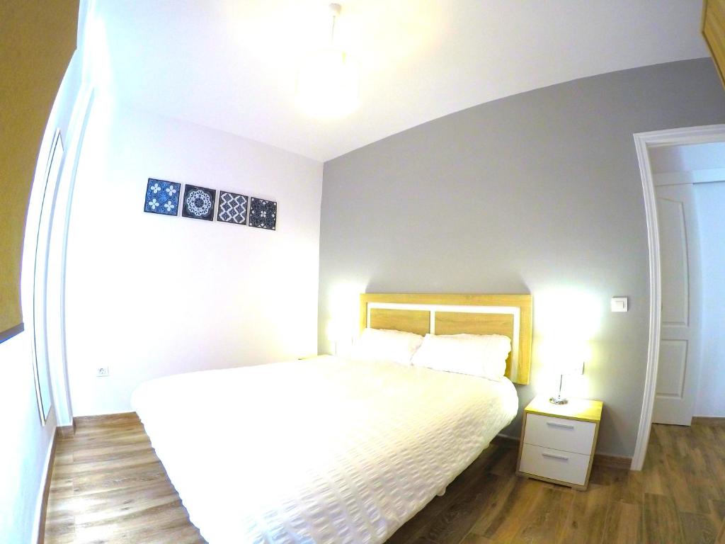 Llit o llits en una habitació de Nina Apartment