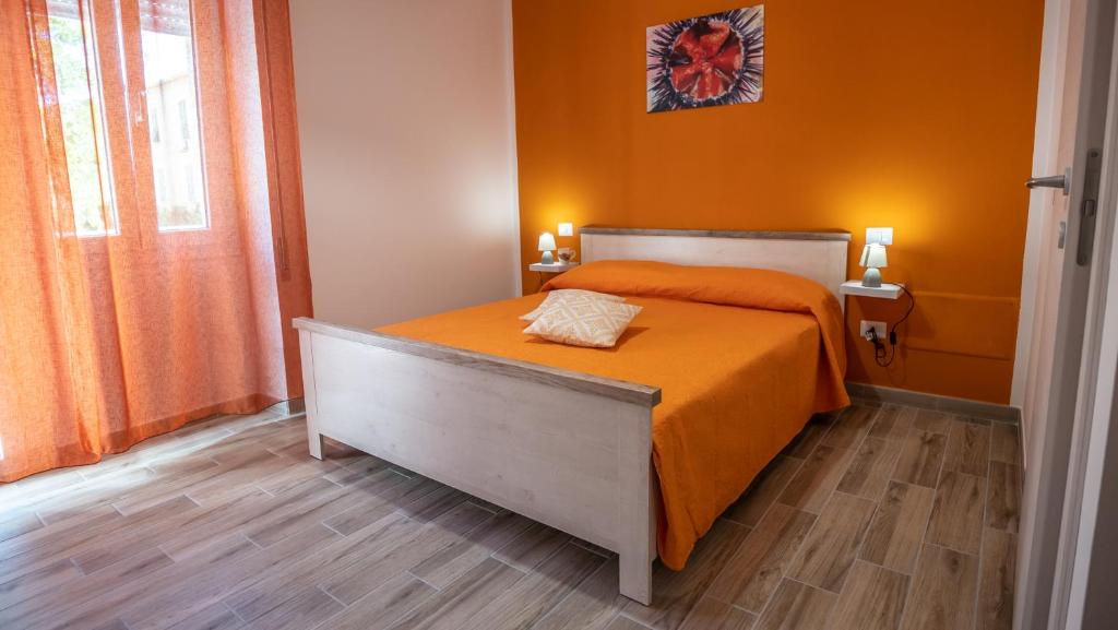 Postel nebo postele na pokoji v ubytování BOSS Guest House