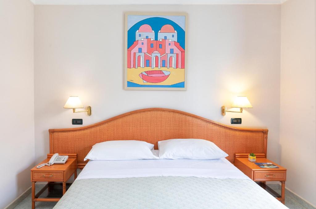 Postel nebo postele na pokoji v ubytování Hotel Belvedere