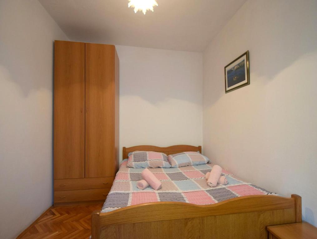 Postel nebo postele na pokoji v ubytování Apartments Blazevic