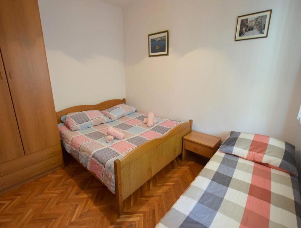 Postel nebo postele na pokoji v ubytování Apartments Blazevic