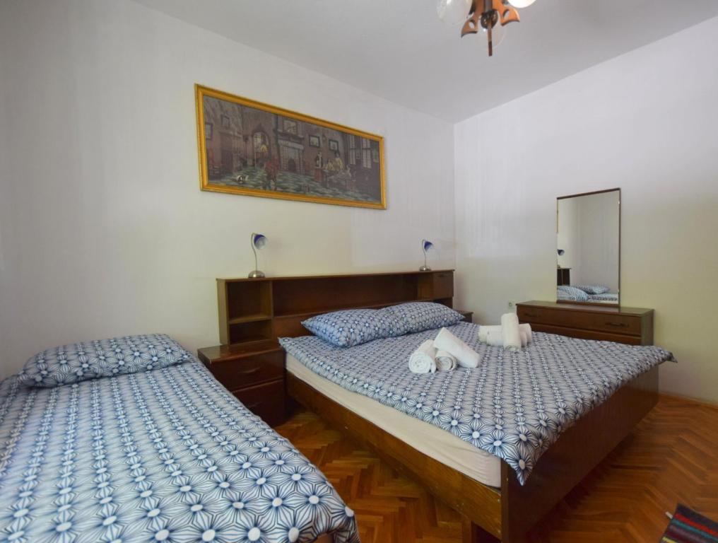 Postel nebo postele na pokoji v ubytování Apartments Blazevic
