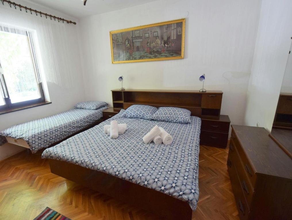 Postel nebo postele na pokoji v ubytování Apartments Blazevic
