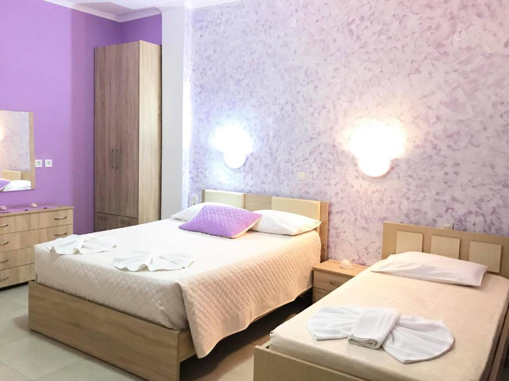 Postel nebo postele na pokoji v ubytování Valeriana Studios