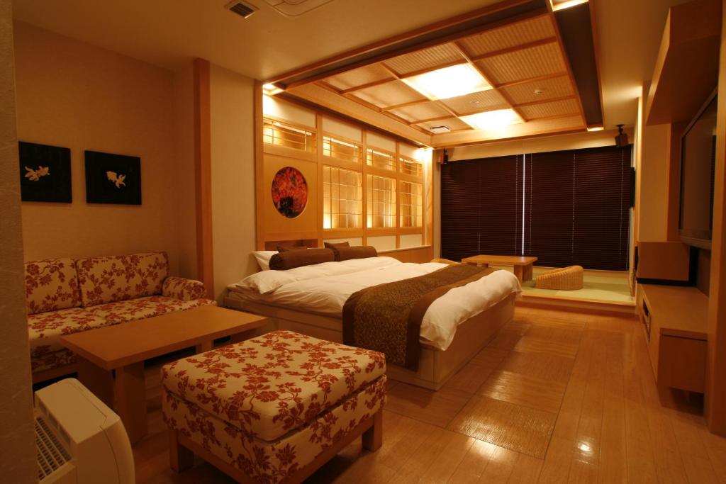 Postel nebo postele na pokoji v ubytování Hotel & Spa Lotus (Adult Only)