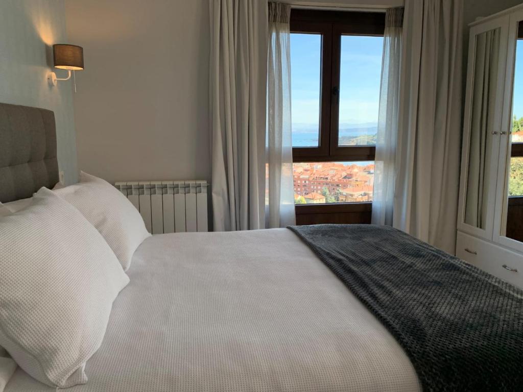 Postel nebo postele na pokoji v ubytování Finca El Palomar de Luanco