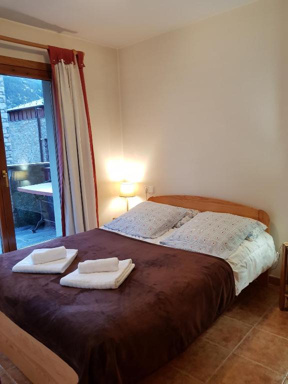 Postel nebo postele na pokoji v ubytování Soldeu Paradis Tarter Mig