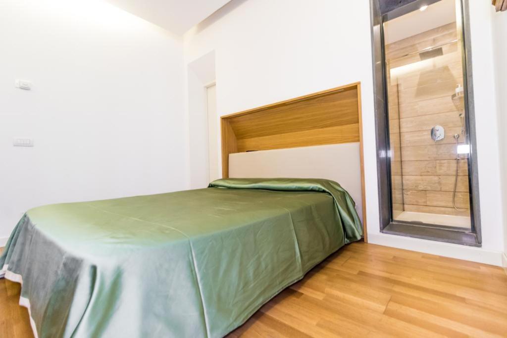 A bed or beds in a room at Nerello Suites and Rooms