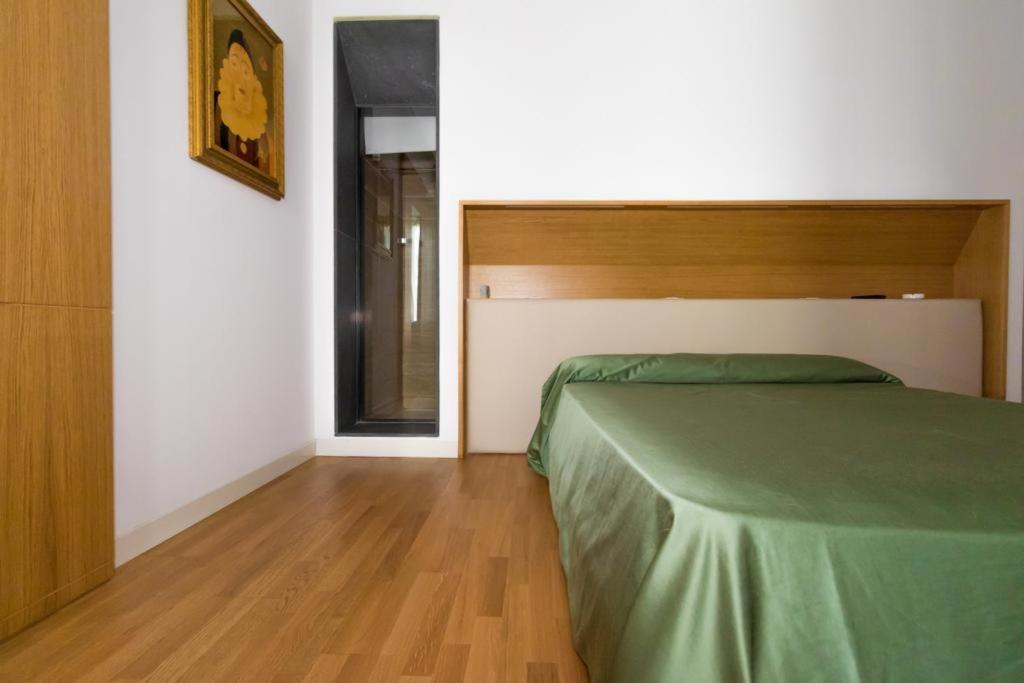 A bed or beds in a room at Nerello Suites and Rooms