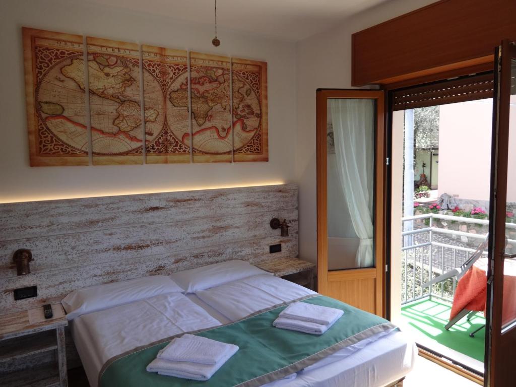 Postel nebo postele na pokoji v ubytování B&B Casa Gabriele
